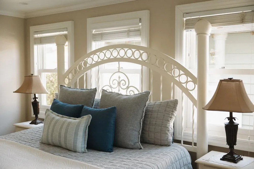 King bedroom with white iron bed